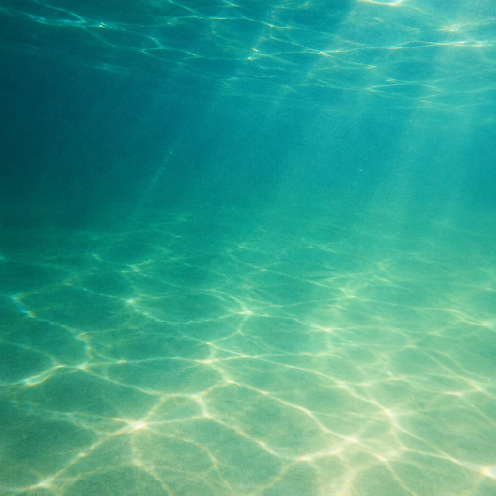 Sunlight filtering through calm turquoise water
